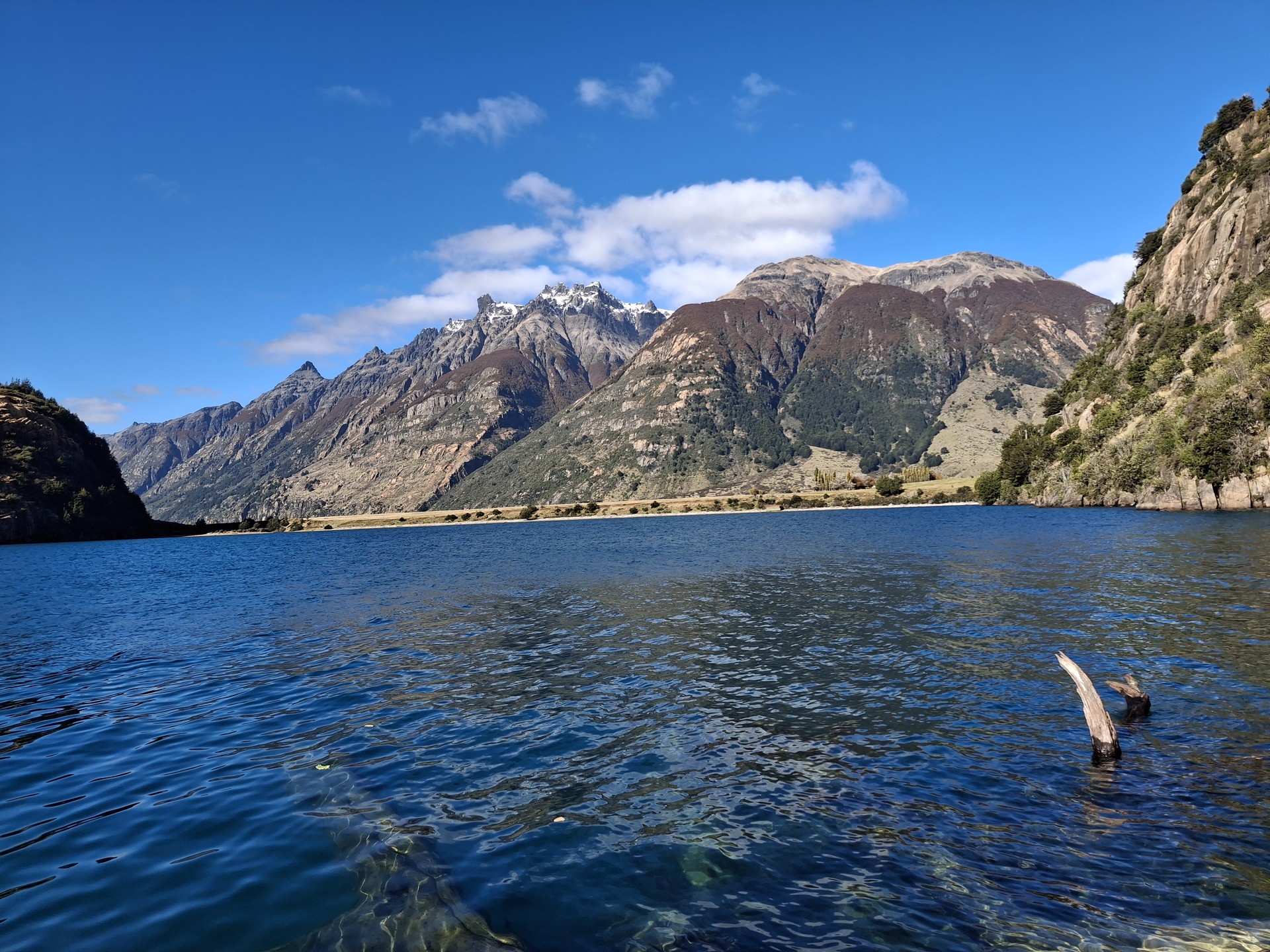 Clear mountain lake and snow-capped peaks in Chilean Patagonia
